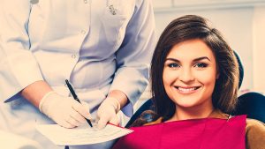 Smiling woman visiting Westtown Dental Associates